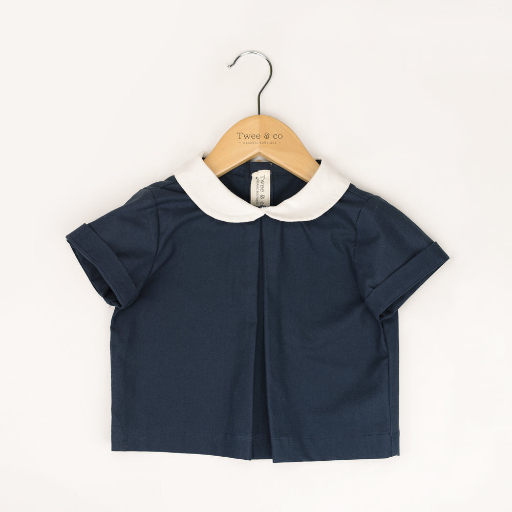 Little Noah, organic cotton navy shirt with white Peter Pan collar — by Twee & Co