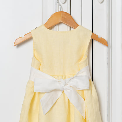 Beautiful lemon coloured dress for girls with cream bow tie