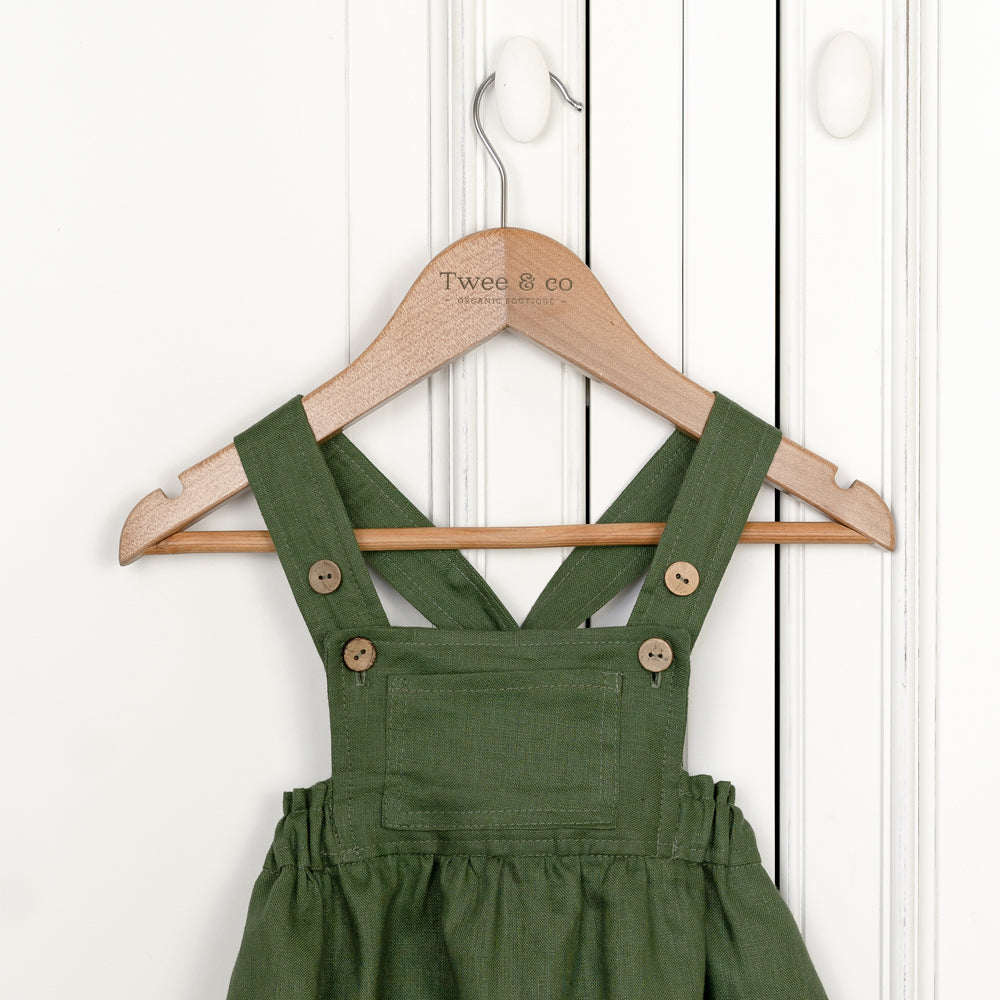Girls forest green pinny made from organic linen by Twee and Co