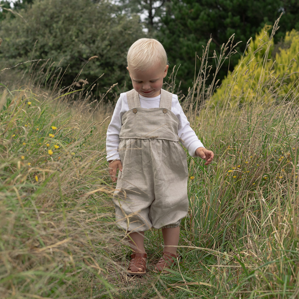 Little baby boy wearing Linen overalls made in New Zealand NZ by Twee & Co Organic Boutique