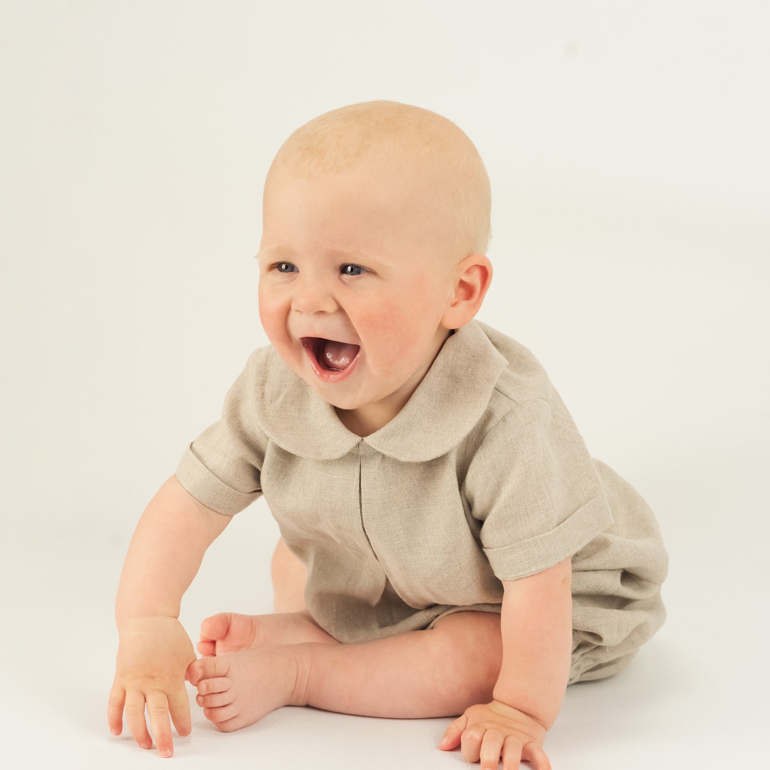 Happy Baby Boy wearing Organic Linen Shirt and Bloomers by Twee and Co